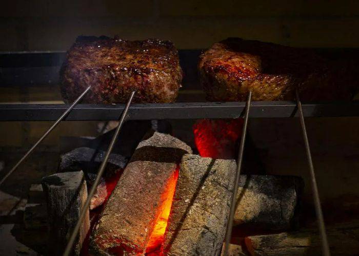 The unique kiln-roasting techniques of Rogama steak arcanum, grilling steak over coal.